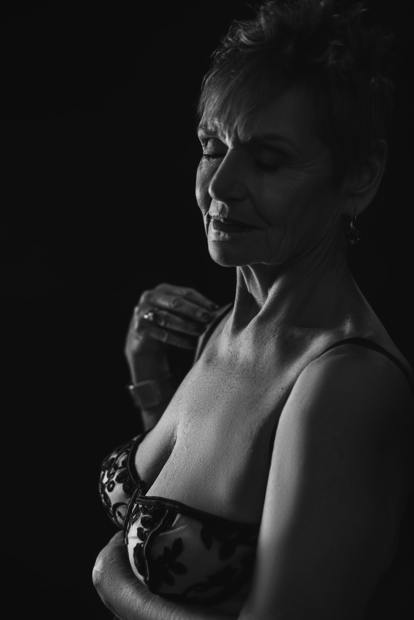 Dark and moody image of a sexy mature woman.